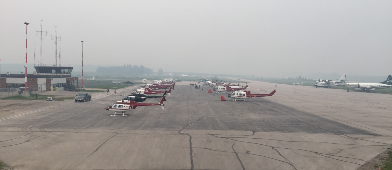 Barber Field Airport, La Ronge helicopters on the tarmac in fog.