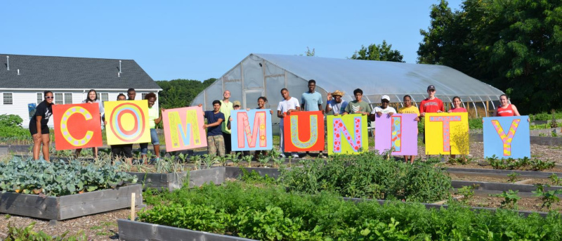 Bridgeport, Connecticut community spelled out with letters on signs held up by people.