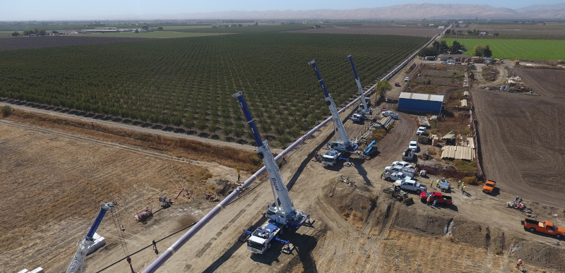 Modesto, California pipeline next to an orchard.