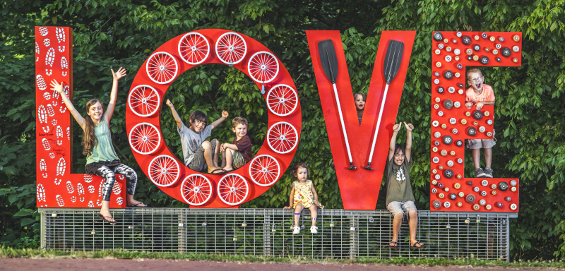 Lynchburg, Virginia LOVE sign with kids sitting on and around the 3D letters.