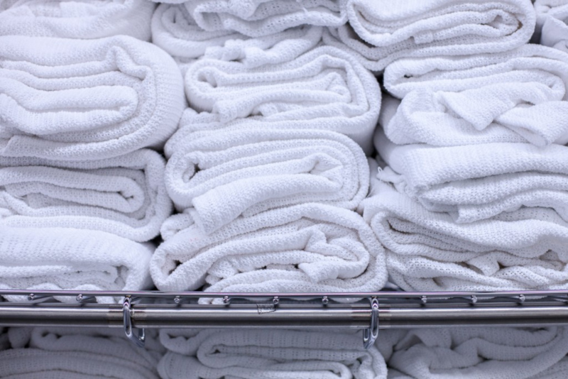 Healthcare Laundry Accreditation Council HLAC stacks of towels.