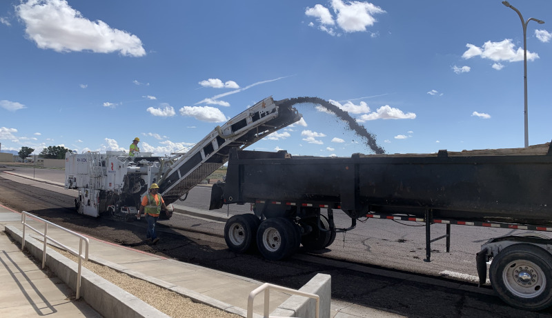 Las Cruces International Airport vehicle stripping pavement.