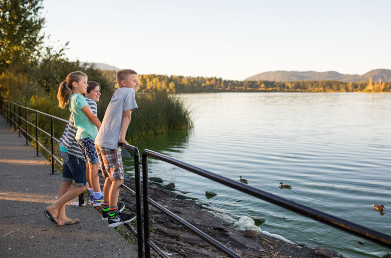 North Cowichan, British Columbia park with a family looking out at water.