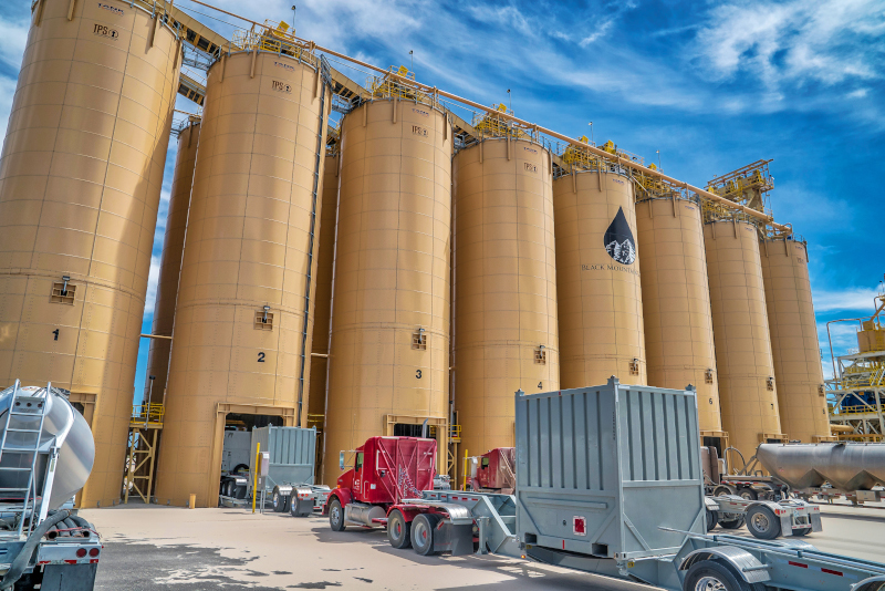 Black Mountain Sand silos and work vehicles.