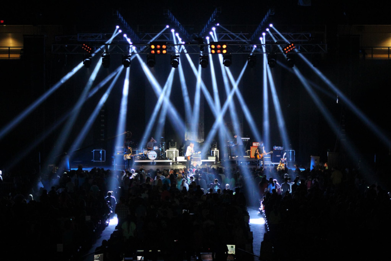 Ford Park lights shining in the dark onto a stage