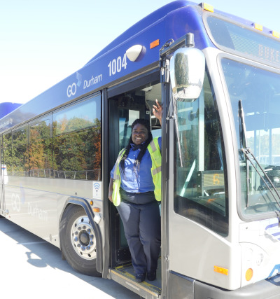 GoDurham bus operator standing in the bus doorway.