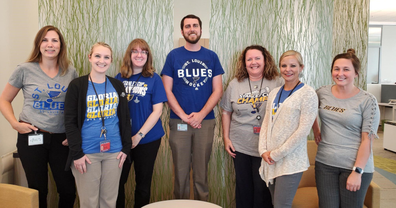 Scott Credit Union group photo staff in blues gear.