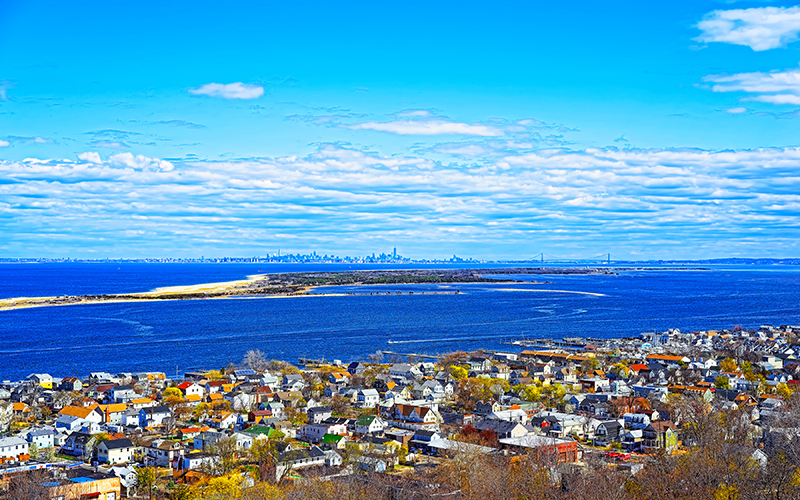 Houses and Atlantic Ocean shore at Sandy Hook reflex