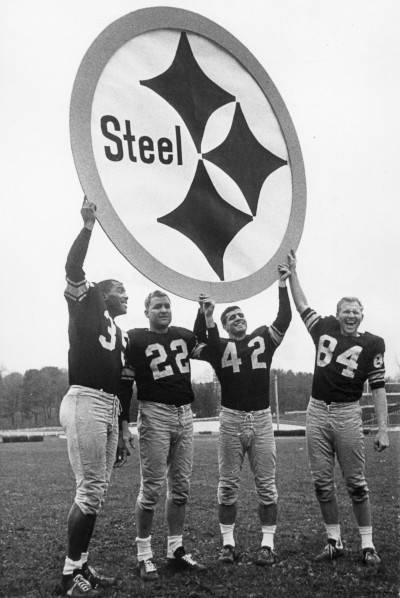 American Iron and Steel Institute. Pittsburgh Steelers holding up Steelmark