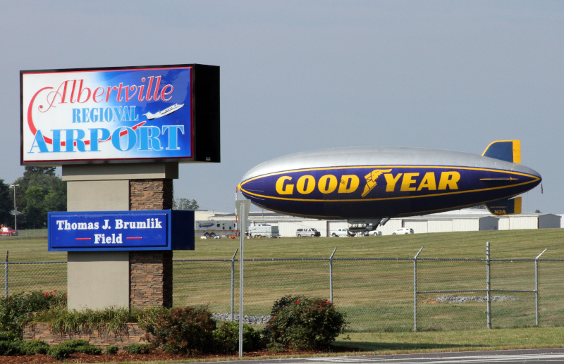 Albertville, Alabama airport view showing the airport sign and a good year blimp.