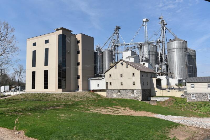 Conewago Manufacturing LLC AgCom building exterior showing a farm building with silos.