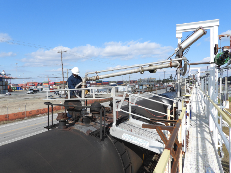 Chemserve Terminal worker loading/unloading train car