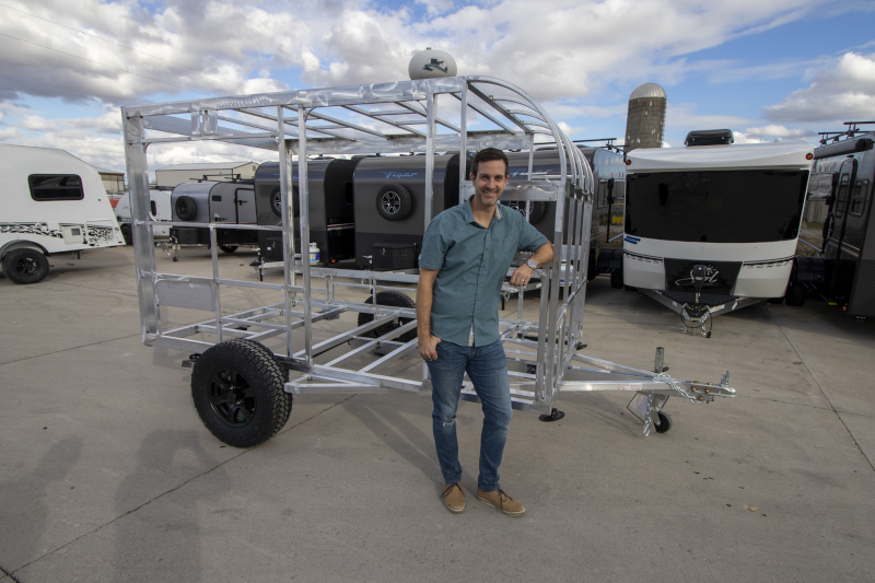 inTech RV male standing in front of an RV frame.