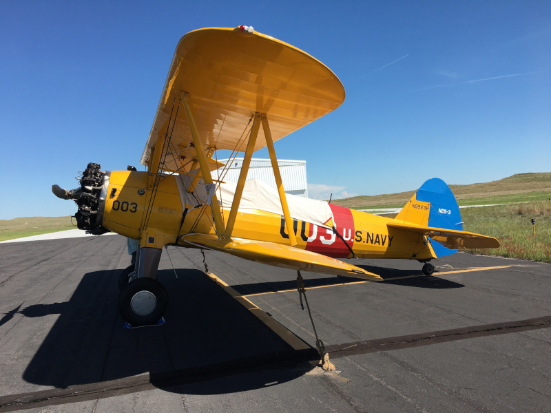 Thomas County Airport navy biplane on runway