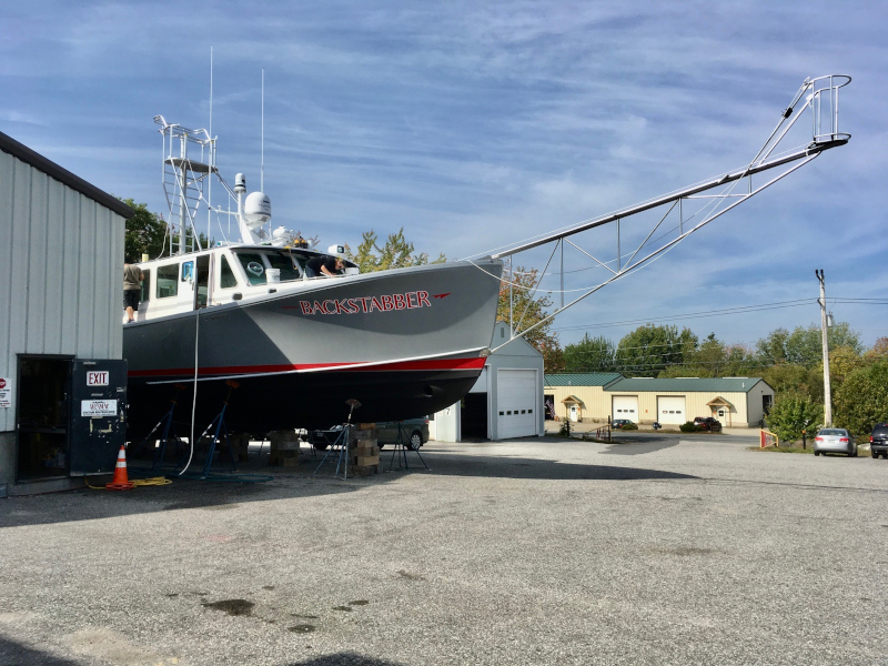 NMRA National Marine Representatives Association boat parked in a parking lot