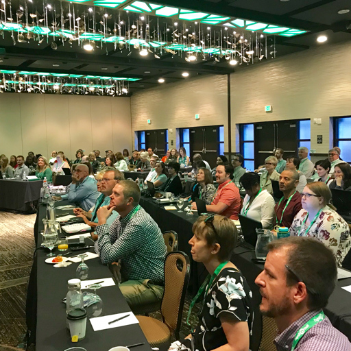 Payroll Vault attendees at an event, sitting at tables