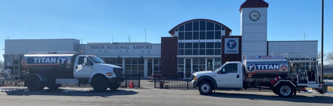 Pryor Field Regional Airport building and service trucks