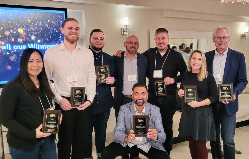 ISA Cybersecurity - Toronto, Ontario, Canada team members posing for a photo holding up their awards.